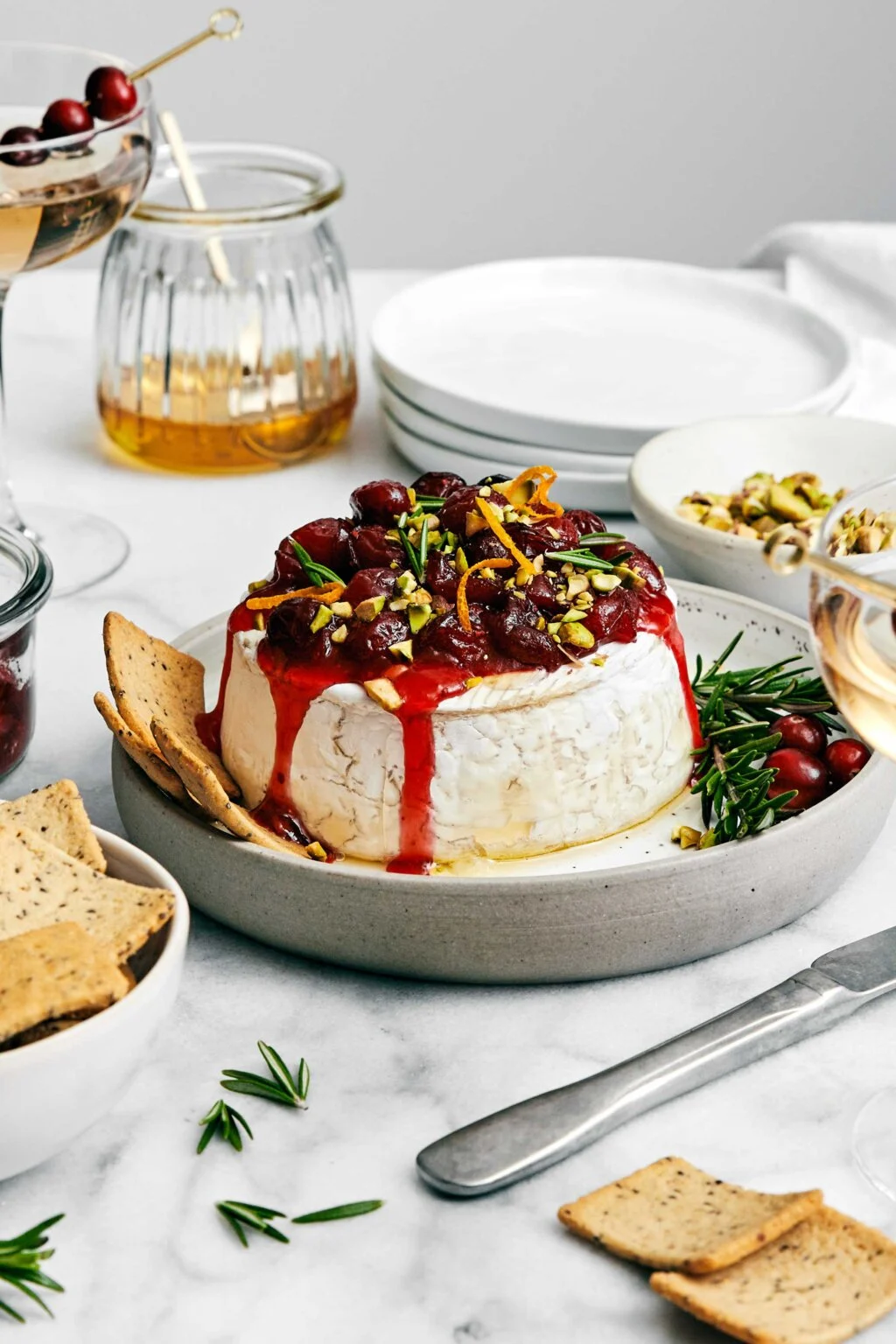 https://kit-food.com/wp-content/uploads/2023/12/Baked-Brie-with-Cranberry-Sauce.webp